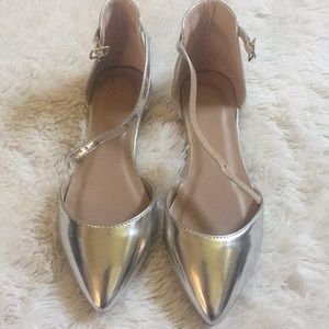 Size 7 pointed toe silver flat. NWOT
